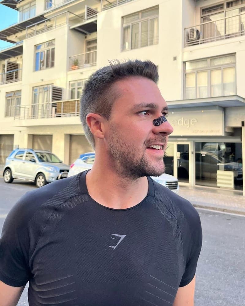 Man in training kit wearing a RestUp nasal strip